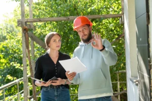 Moss Doctors contractor speaking with a homeowner about siding pricing
