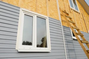 Pacific Northwest house getting siding repairs done